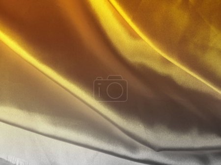 Foto de Abstracto borroso gris oscuro patrón de tela amarilla de oro para fondo o ilustración, producto gráfico de diseño publicitario, elegante horizontal - Imagen libre de derechos