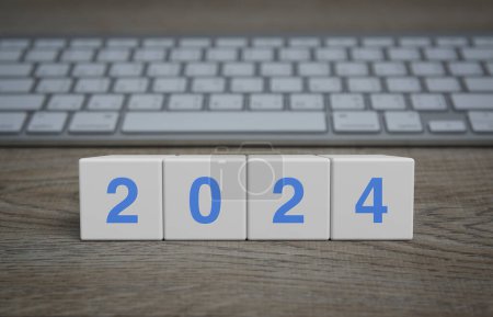 Photo for 2024 letter on white block cubes on wooden table with modern computer keyboard, Happy new year 2024 technology online concept - Royalty Free Image