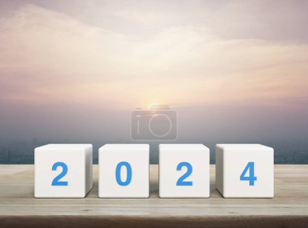 Photo for 2024 letter on white block cubes on wooden table over modern city tower and skyscraper at sunset, vintage style, Happy new year 2024 cover concept - Royalty Free Image