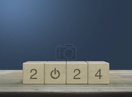 Photo for 2024 start up business icon on wood block cubes on wooden table over light blue wall, Happy new year 2024 success concept - Royalty Free Image