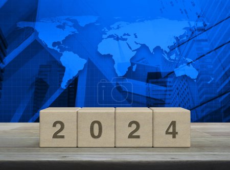 Photo for 2024 letter on wood block cubes on wooden table over world map, modern office city tower and skyscraper, Happy new year 2024 cover concept, Elements of this image furnished by NASA - Royalty Free Image