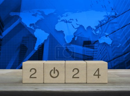 Photo for 2024 start up business icon on wood block cubes on wooden table over world map, modern office city tower and skyscraper, , Happy new year 2024 success concept, Elements of this image furnished by NASA - Royalty Free Image