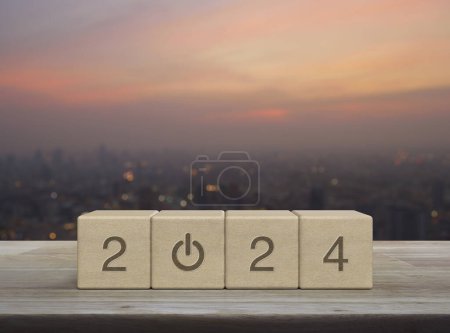 Photo for 2024 start up business icon on wood block cubes on wooden table over blur of cityscape on warm light sundown, Happy new year 2024 success concept - Royalty Free Image