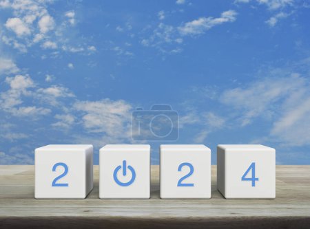 Photo for 2024 start up business icon on white block cubes on wooden table over blue sky with white clouds, Happy new year 2024 success concept - Royalty Free Image