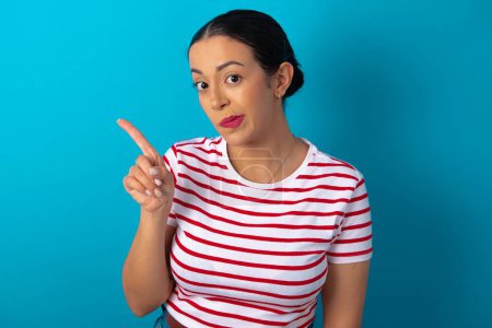 Photo for No sign gesture. Closeup portrait unhappy woman wearing striped T-shirt raising fore finger up saying no. Negative emotions facial expressions, feelings. - Royalty Free Image