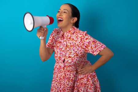 Photo for Funny woman wearing floral dress People sincere emotions lifestyle concept. Mock up copy space. Screaming in megaphone. - Royalty Free Image