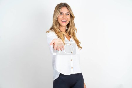 Photo for Young caucasian businesswoman wearing white shirt over white background smiling cheerful offering palm hand giving assistance and acceptance. - Royalty Free Image