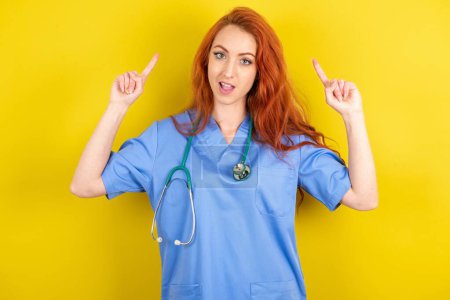 Photo for Cheerful young red-haired doctor woman demonstrating hairdo - Royalty Free Image