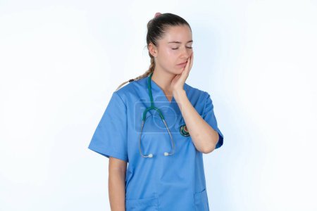 Photo for Caucasian woman doctor in  uniform with stethoscope doctor with toothache - Royalty Free Image