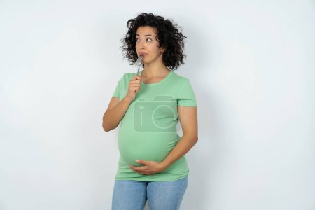 Photo for Photo of dreamy pregnant woman lick fork look empty space - Royalty Free Image