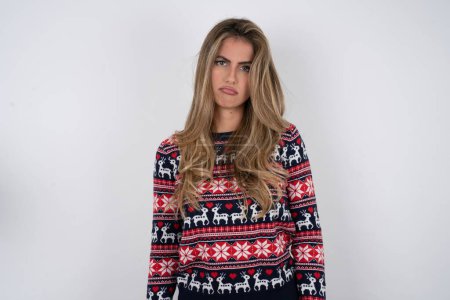 Photo for Caucasian woman wearing christmas sweater depressed and worry for distress, crying angry and afraid. Sad expression. - Royalty Free Image