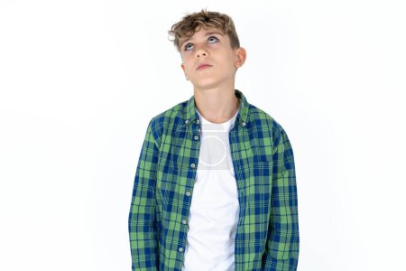 Photo for Handsome caucasian teenager boy on white studio background looking sleepy and tired, exhausted for fatigue and hangover, lazy eyes in the morning. - Royalty Free Image