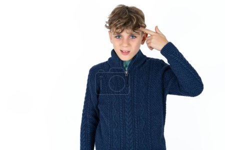 Photo for Handsome caucasian teenager boy on white studio background pointing unhappy at pimple on forehead, blackhead  infection. Skincare concept. - Royalty Free Image