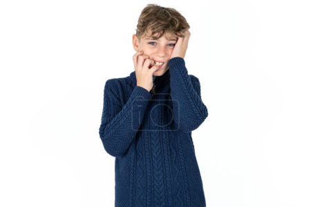 Photo for Doleful desperate crying handsome caucasian teenager boy on white studio background looks stressfully, frowns face, feels lonely and anxious - Royalty Free Image