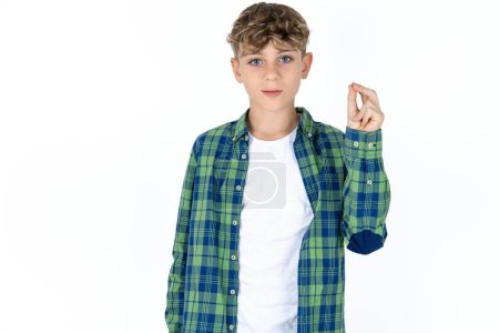 Photo for Handsome caucasian teenager boy on white studio background pointing up with hand showing up seven fingers gesture in Chinese sign language Q. - Royalty Free Image