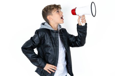 Photo for Funny handsome caucasian teenager boy on white studio background People sincere emotions lifestyle concept. Mock up copy space. Screaming in megaphone. - Royalty Free Image