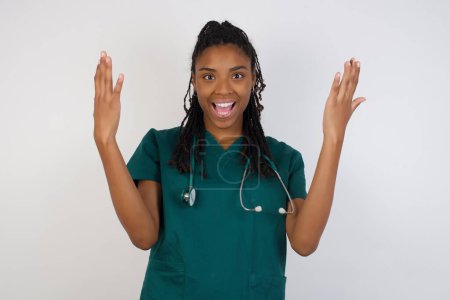 Photo for People, success, winning, victory, excitement, goals, determination and achievement concept. Joyful excited lucky doctor woman cheering, celebrating success, screaming yes with clenched fists - Royalty Free Image