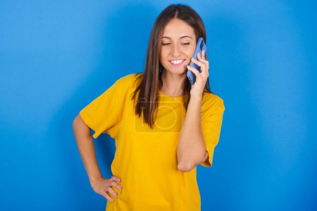 Photo for Portrait of successful joyful beautiful young woman talking on mobile phone with friend. Lifestyle and communication concept - Royalty Free Image