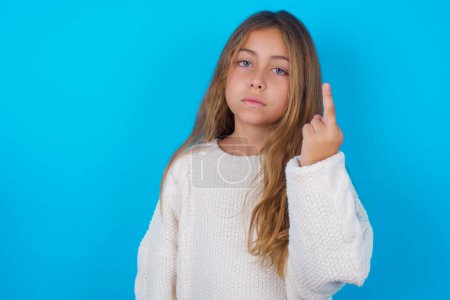 pretty teen girl shows middle finger bad sign asks not to bother. Provocation and rude attitude.
