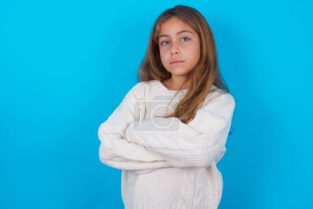 Photo for Confident pretty teen girl with arms crossed looking to the camera - Royalty Free Image