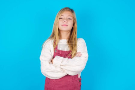 Photo for Self confident serious calm pretty teen girl stands with arms folded. Shows professional vibe stands in assertive pose. - Royalty Free Image