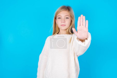 Photo for Pretty girl doing stop gesture with palm of the hand. Warning expression with negative and serious gesture on the face. - Royalty Free Image