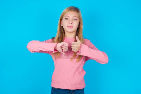 pretty teen girl showing thumb up down sign