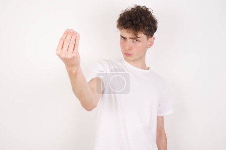 Photo for Young man Doing Italian gesture with hand and fingers confident expression - Royalty Free Image