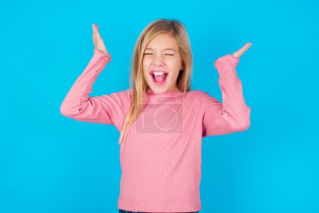 Photo for Pretty teen girl goes crazy as head goes around feels stressed because of horrible situation - Royalty Free Image