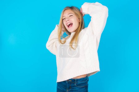 Photo for Pretty girl relaxing and stretching, arms and hands behind head and neck smiling happy - Royalty Free Image