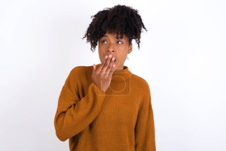 Photo for Sleepy young woman yawning with messy hair, feeling tired after sleepless night, yawning, covering mouth with palm. - Royalty Free Image
