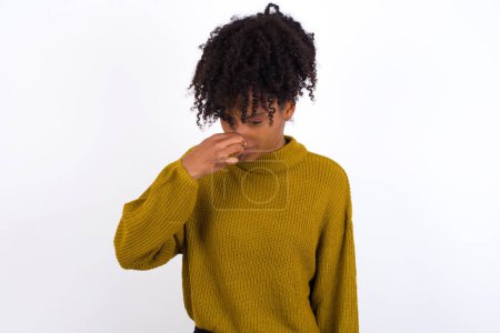 Photo for Young woman, holding his nose because of a bad smell. - Royalty Free Image