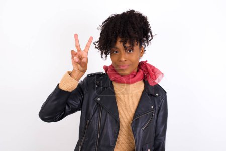 Photo for Young woman showing and pointing up with fingers number two while smiling confident and happy. - Royalty Free Image