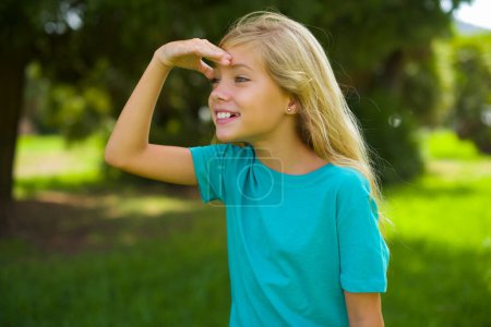 Photo for Playful excited pretty girl in park - Royalty Free Image