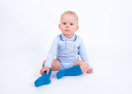Photo for Portrair of cute little kid boy wearing blue singlet posing over white studio background - Royalty Free Image