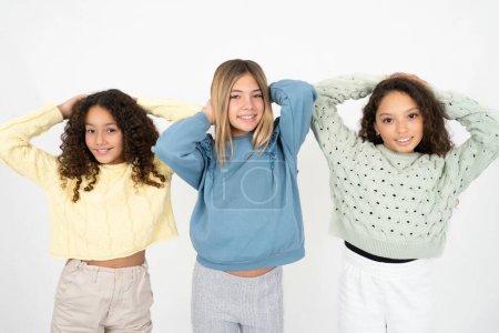 Photo for Three teenager girls stretching arms, relaxed position. - Royalty Free Image