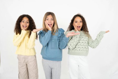 Photo for Crazy three teenager girls advising discount prices hold open palm new product - Royalty Free Image