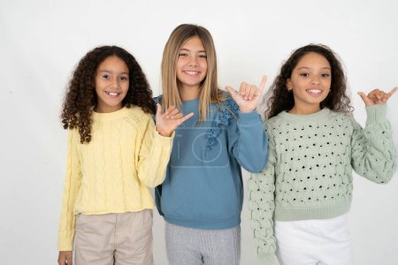 Photo for Three teenager girls showing up number six Liu with fingers gesture in sign Chinese language - Royalty Free Image