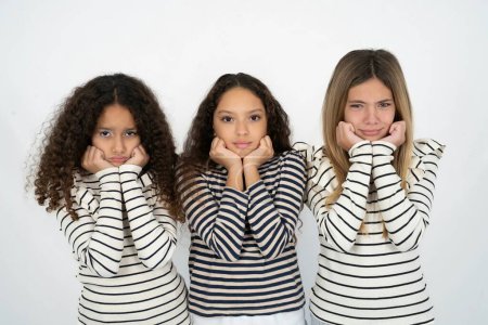 Photo for Portrait of sad three teenager girls hands face - Royalty Free Image