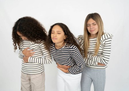 Photo for Three teenager girls got stomachache - Royalty Free Image