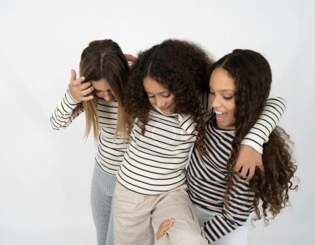 multiracial group of girls friends hugging, laughing, playing happy and positive. Self love and self care.