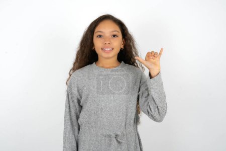 Photo for Teenager girl wearing grey sweater showing up number six Liu with fingers gesture in sign Chinese language - Royalty Free Image