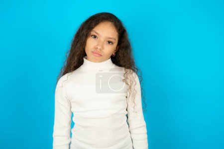 Photo for Teenager girl wearing white sweater depressed and worry for distress, crying angry and afraid. Sad expression. - Royalty Free Image