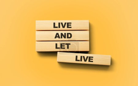 Téléchargez les photos : Live And Let Live Texte sur des blocs en bois isolés sur fond orange, illustration 3D - en image libre de droit