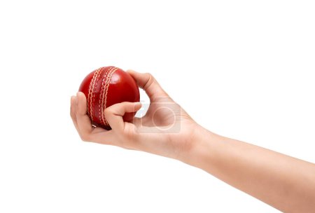 Weibliche Bowler Griff zum roten Test Cricket Ball Nahaufnahme Foto von weiblichen Cricketer Hand About To Bowl