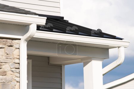Photo for New rain gutter on a home against blue sky rain facade white - Royalty Free Image