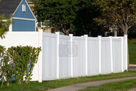 Photo for White vinyl fence outdoor backyard home private green yard house - Royalty Free Image