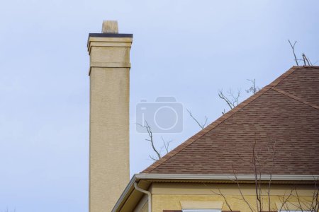 Photo for Outdoor chimney from a fireplace roof top day - Royalty Free Image