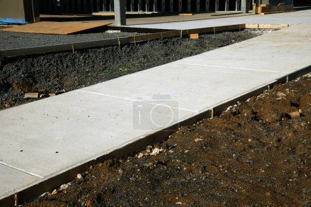 neue Beton Fußweg Bürgersteig Zement Straße Material grau Kies städtischer Gehweg Straße Stadt Asphalt