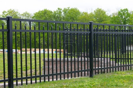 black steel fence of residential house modern style secure green ornament